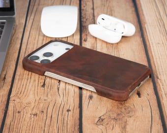 May include: A dark brown leather smartphone case with a smooth, matte texture covering the back and sides, featuring precise cutouts for the camera lenses and side buttons, designed to fit a modern smartphone with a triple-lens camera system.