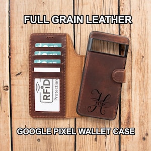 May include: A brown full grain leather Google Pixel wallet case featuring multiple card slots, an RFID protection label, and a personalized monogram with the name Henry engraved on the front cover. The case is open to display the interior.
