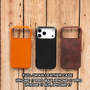 May include: Three full-grain leather phone cases in orange, black, and brown. The orange and brown cases have an open design, while the black case has a camera cutout. The text at the bottom reads "FULL GRAIN LEATHER CASE IPHONE 17 PRO MAX, IPHONE 17 PRO, IPHONE 17 AIR, IPHONE 17."