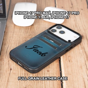 May include: A full-grain leather phone case with a teal blue finish, featuring the name "Jack" in script. The case is designed for iPhone 17 Pro Max, 17 Pro, 17 Air, and 17 models. A laptop and accessories are in the background.