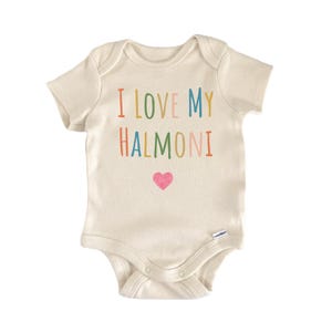 May include: Cream-colored baby bodysuit with the text "I LOVE MY HALMONI" in colorful letters and a pink heart. The bodysuit has short sleeves and snaps at the bottom for easy changes. A cute and comfortable outfit for a baby.