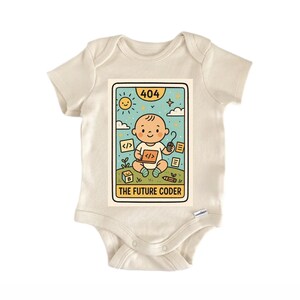 May include: Cream-colored baby onesie with a colorful graphic. The graphic features a cartoon baby holding a coding symbol, with the text "THE FUTURE CODER" at the bottom. The design includes a sun, clouds, and the number "404".