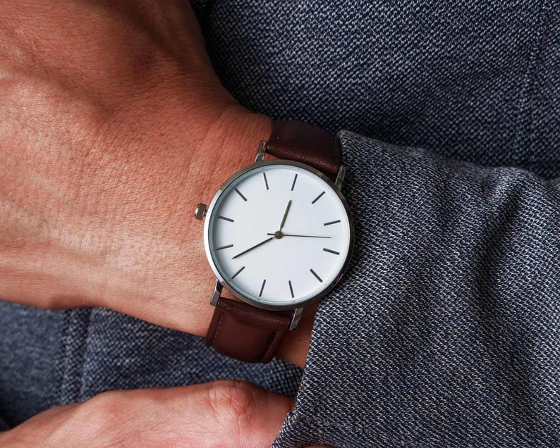 a close up of a person wearing a watch