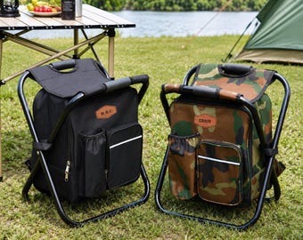 May include: Two portable folding stool backpacks with black metal frames. One is solid black, the other features a camouflage pattern. Both include a front pocket, a side bottle holder, and a brown leather-like patch with the text W.B.C. or CHRIS.