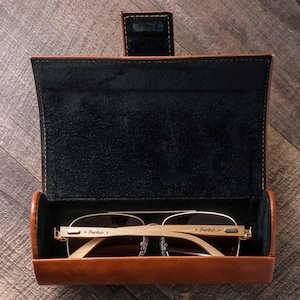a pair of glasses in a leather case