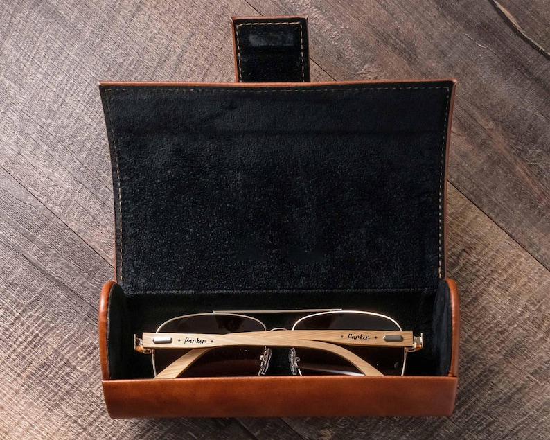 a pair of glasses in a leather case