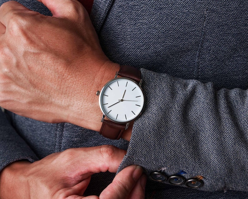 a close up of a person wearing a watch