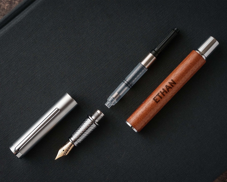 a pen and a lighter on a black surface