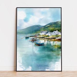 May include: Watercolor painting of a coastal village with white houses, boats, and green hills under a cloudy blue sky. The artwork is framed in a black border, evoking a serene and picturesque landscape.