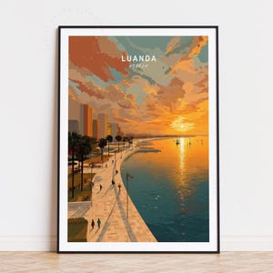 May include: A framed art print of Luanda, Angola, depicting a vibrant sunset over the city's coastline. The artwork features a warm color palette with shades of orange, yellow, and blue, showcasing the city's skyline, palm trees, and waterfront promenade.