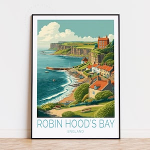 Pode incluir: Uma impressão artística emoldurada de Robin Hood's Bay, Inglaterra. A obra retrata uma vila costeira com edifícios de telhados vermelhos, um porto e uma falésia. O mar é azul escuro e o céu é azul claro com nuvens brancas. O texto "ROBIN HOOD'S BAY" e "ENGLAND" está na parte inferior.