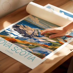 May include: A colorful illustration of a rocky coastline with a lighthouse in the distance. The text "Nova Scotia, Canada" is printed in blue and white on the bottom of the image.