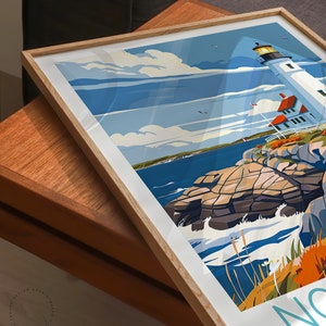 May include: A framed poster with a retro-style illustration of a lighthouse on a rocky coast. The lighthouse is white with a red roof and a yellow light at the top. The sky is blue with white clouds. The ocean is blue with white waves. The text "Nantucket" is visible in the lower right corner.