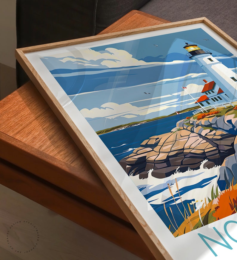 May include: A framed poster with a retro-style illustration of a lighthouse on a rocky coast. The lighthouse is white with a red roof and a yellow light at the top. The sky is blue with white clouds. The ocean is blue with white waves. The text "Nantucket" is visible in the lower right corner.