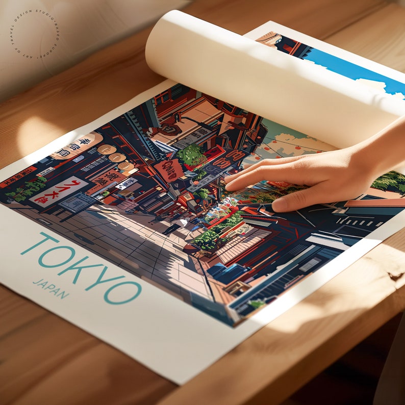 May include: A colourful illustration of a street scene in Tokyo, Japan. The image features a narrow street lined with shops and buildings, with people walking along the street. The text "TOKYO" and "JAPAN" is printed in a teal blue font at the bottom of the image.