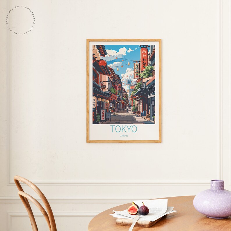 May include: A vintage-style poster with an illustration of a street scene in Tokyo, Japan. The poster features a narrow street lined with traditional Japanese buildings, with red lanterns hanging overhead. The text "TOKYO" and "JAPAN" is printed at the bottom of the poster.