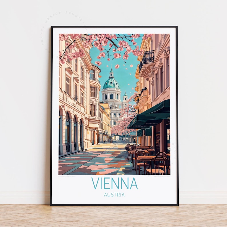 May include: A framed art print of Vienna, Austria. The illustration shows a street scene with buildings, a domed church, and cherry blossoms. The text "VIENNA AUSTRIA" is at the bottom of the print.