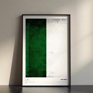 May include: A framed vertical print featuring a split design with a textured dark green panel on the left and a textured off-white panel on the right. The bottom white border contains the text FEAR MANACH and a small map illustration.