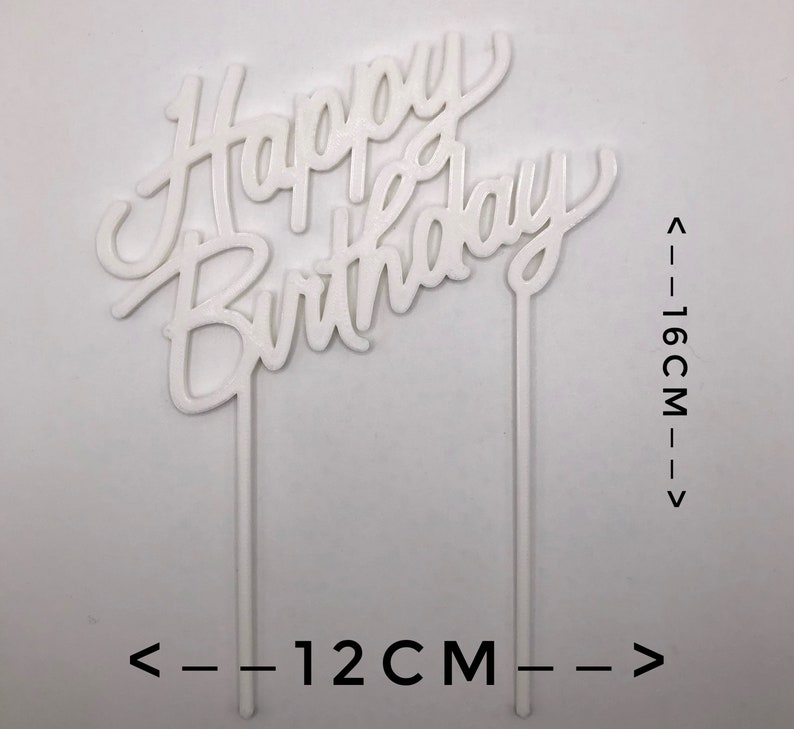May include: White plastic cake topper with the words "Happy Birthday" in a cursive font. The topper is 12 inches wide and 16 inches tall.