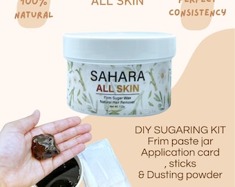 May include: A DIY sugaring kit with a jar of sugar wax, application cards, sticks, and dusting powder. The jar is labelled "Sahara All Skin Firm Sugar Wax Natural Hair Remover, Net Wt. 7 Oz."