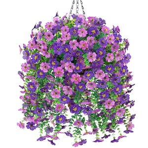 May include: A hanging basket overflowing with vibrant purple and pink artificial flowers. The flowers have yellow centers and green foliage, creating a full, lush appearance. A black chain suspends the basket, perfect for adding a touch of color to any space.