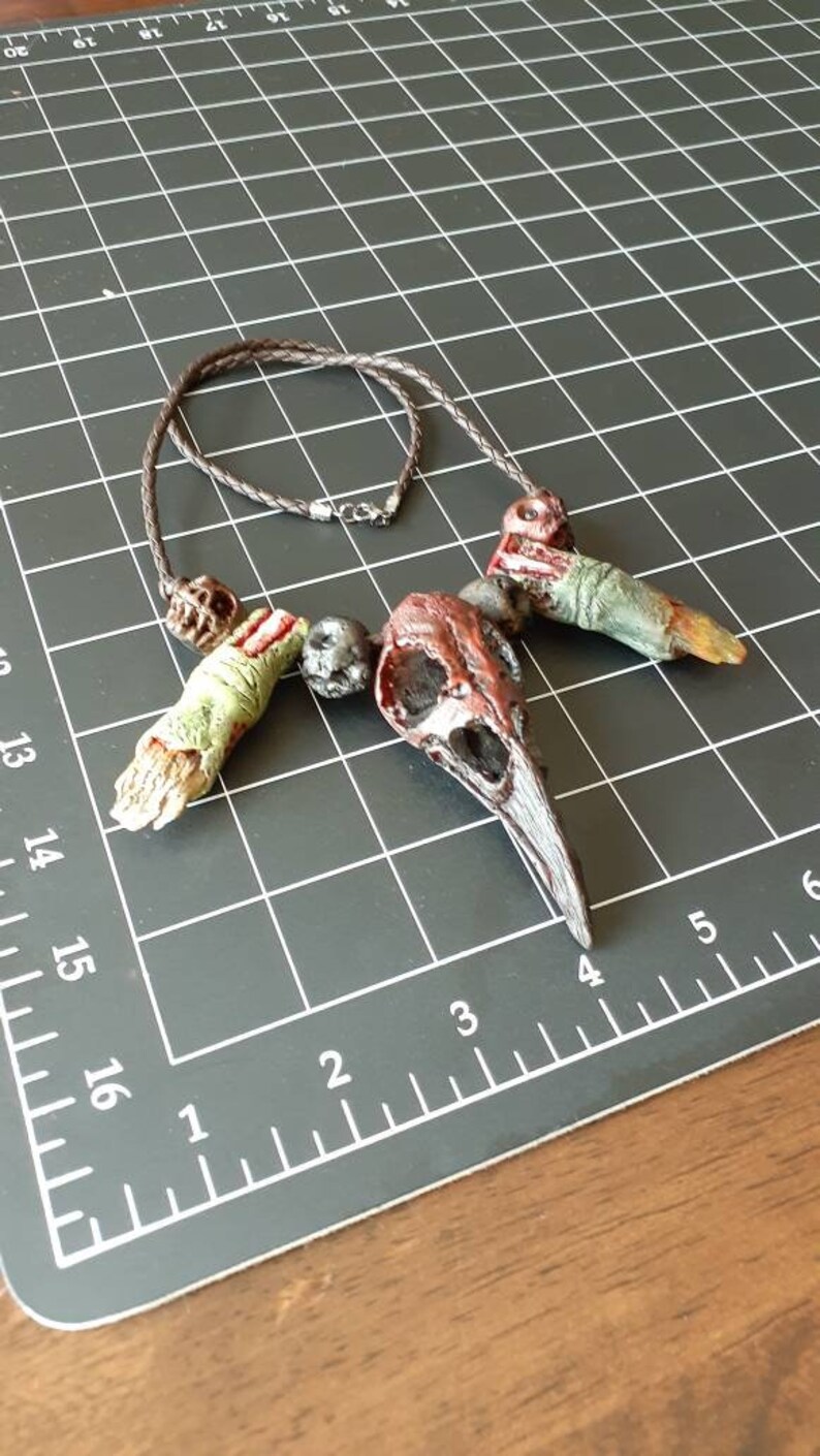 Raven crow skull and zombie finger necklace
