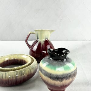 May include: A rustic wooden sign with the text "Welcome to our home" in white lettering. The sign features a distressed finish and a simple, inviting design, perfect for a front porch or entryway.