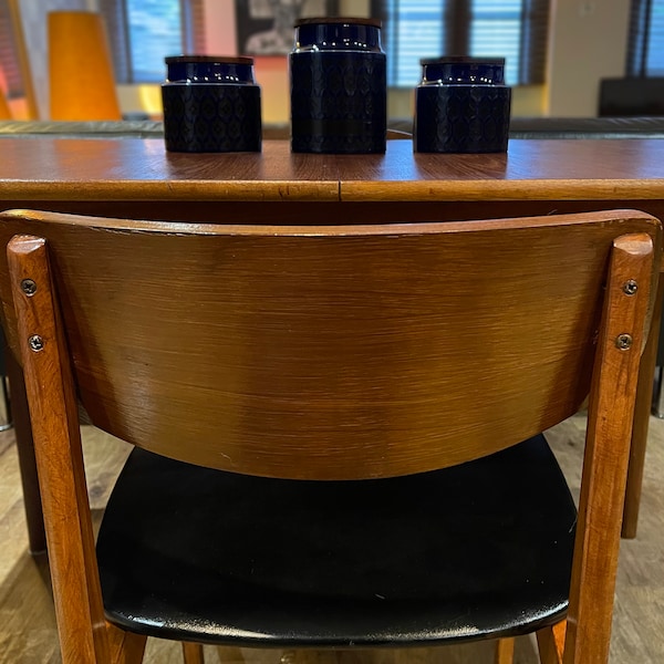 Extending McIntosh teak dining table fully restored with four restored butterfly style retro chairs with original upholstery