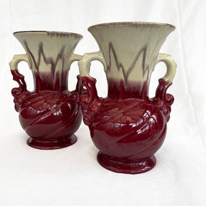 An attractive pair of Mid century fat lava glaze German handled vases