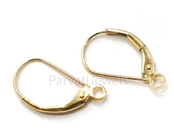 May include: Two gold-toned earring hooks, also known as leverback earring findings, are shown against a white background.