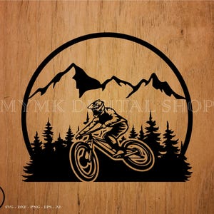 May include: Black and white silhouette of a mountain biker riding downhill on a mountain bike with a mountain range in the background.