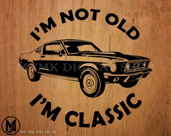 May include: Black and white silhouette of a classic car with the text "I'm not old, I'm classic" on a woodgrain background.