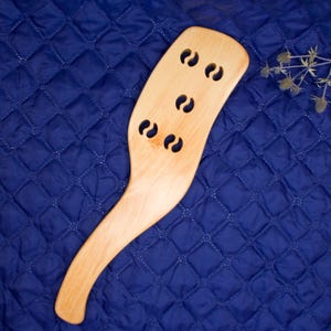 Wooden spanking paddle for adults