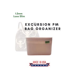 May include: A light pink bag organizer with the text "EXCURSION PM BAG ORGANIZER" and "MADE IN USA" with five stars. The organizer is 1.2mm Luxe Slim.