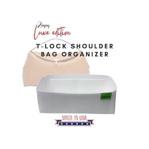 May include: A white T-lock shoulder bag organizer with a beige bag in the background. The organizer has two compartments and a green tag. Text on the image reads "2mm Luxe edition" and "Made in USA."