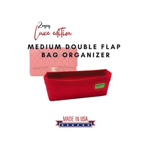 May include: A red bag organizer with a green tag, designed for a medium double flap bag. The text reads "2mm Luxe edition" and "MADE IN USA". A pink quilted bag is shown in the background.