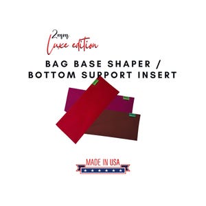 May include: Three rectangular bag base shapers in red, burgundy, and brown. The text reads "2mm Luxe edition BAG BASE SHAPER / BOTTOM SUPPORT INSERT" and "MADE IN USA". The shapers have a green tag on one end.