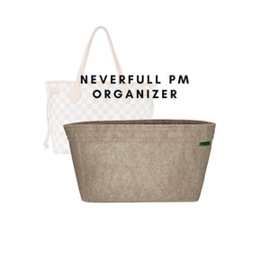 May include: A beige felt bag organizer for a Neverfull PM handbag. The organizer has a green label with the word "ORGANIZER" on it.