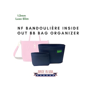 Op de afbeelding: Een zwarte felt tas organizer met een groen label waarop "GREENONE" staat, en de tekst "NF BANDOULIÈRE INSIDE OUT BB BAG ORGANIZER" en "MADE IN USA" met vijf sterren.
