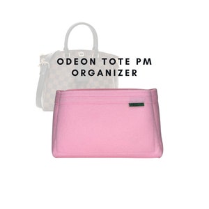 May include: Pink felt bag organiser for a Louis Vuitton Odeon Tote PM handbag. The organiser has a Green Bag label on the front.