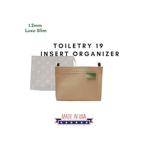 May include: Beige felt insert organizer for a toiletry bag. The organizer has a green tag that says "GreenTag" and the text "TOILETRY 19 INSERT ORGANIZER" is printed in black on a white background. The text "MADE IN USA" is printed in black on a white background with five stars below it.