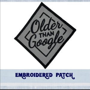 May include: Embroidered patch with a gray background and black stitching. The text reads "Older than Google" in a stylized font.