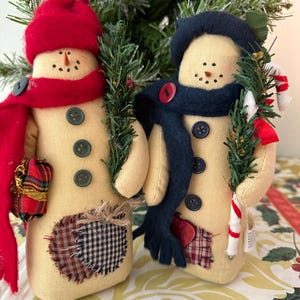 May include: A set of three ceramic mugs with a speckled, matte finish. The mugs are in shades of cream, light gray, and dark gray. Each mug has a simple, minimalist design, perfect for coffee or tea.