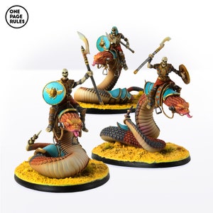 May include: Three miniature skeletal figures riding on painted, sculpted, serpentine creatures. Each figure is wearing a blue and gold headdress and holding a spear. The figures are mounted on a base with a yellow sand texture.