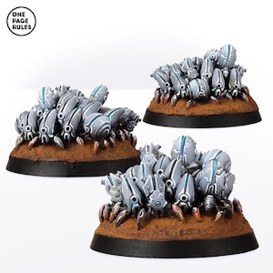 May include: Three groups of small, silver, and blue, spider-like creatures on brown bases. The creatures are arranged in a cluster, with their legs pointing outwards.