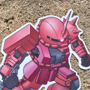 May include: A red and gray cartoon robot with a large gun. The robot is in a running pose with its right leg forward. The robot has a large head with a single eye and a red visor. The robot is on a gray background.