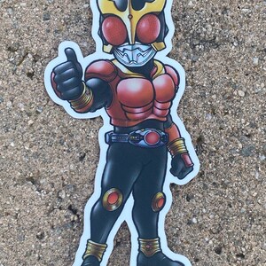 May include: A red and black cartoon character with a yellow helmet and red eyes gives a thumbs up. The character is wearing a belt with a red circle in the center. The character is standing on a white background.