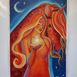 May include: An original painting depicting a woman with long, flowing orange hair, holding a glowing star. A reddish-brown horse is beside her, set against a blue night sky with a crescent moon and stars. The artwork is signed "O. Salaris".