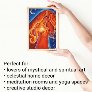 May include: A framed artwork featuring a woman with flowing red hair holding a glowing star, with a horse in the background. The artwork is set against a blue night sky with a crescent moon. The frame is light brown.