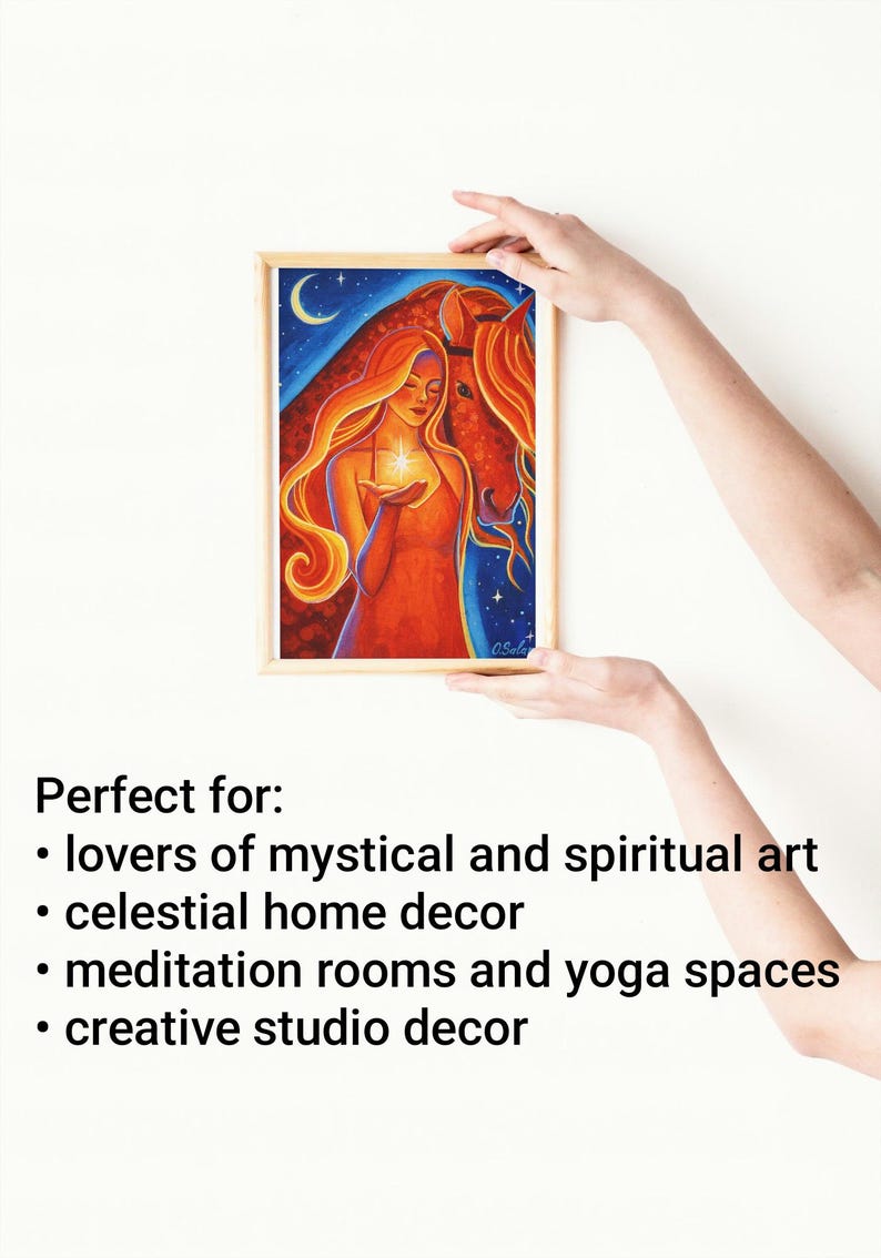 May include: A framed artwork featuring a woman with flowing red hair holding a glowing star, with a horse in the background. The artwork is set against a blue night sky with a crescent moon. The frame is light brown.